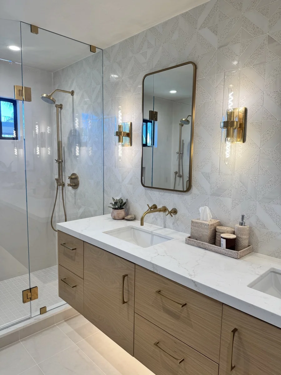 Custom geometric tile bathroom remodel with gold fixtures — SB Tile Pro, Santa Barbara