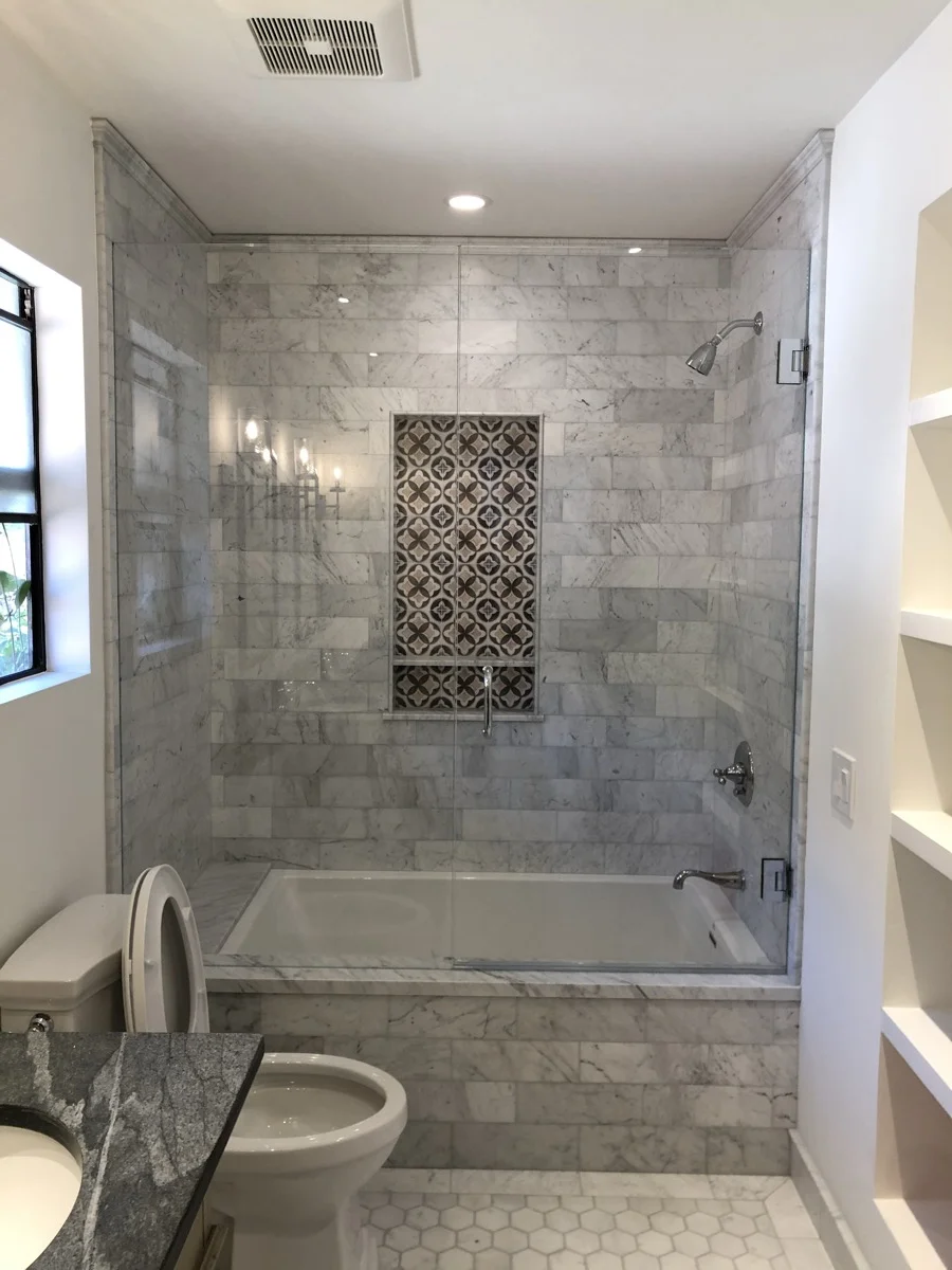 Luxury marble tile shower with decorative niche — SB Tile Pro, Santa Barbara CA
